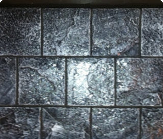 Concrete panel cast in the Best Slate pattern, showing large cleaved slate slabs.