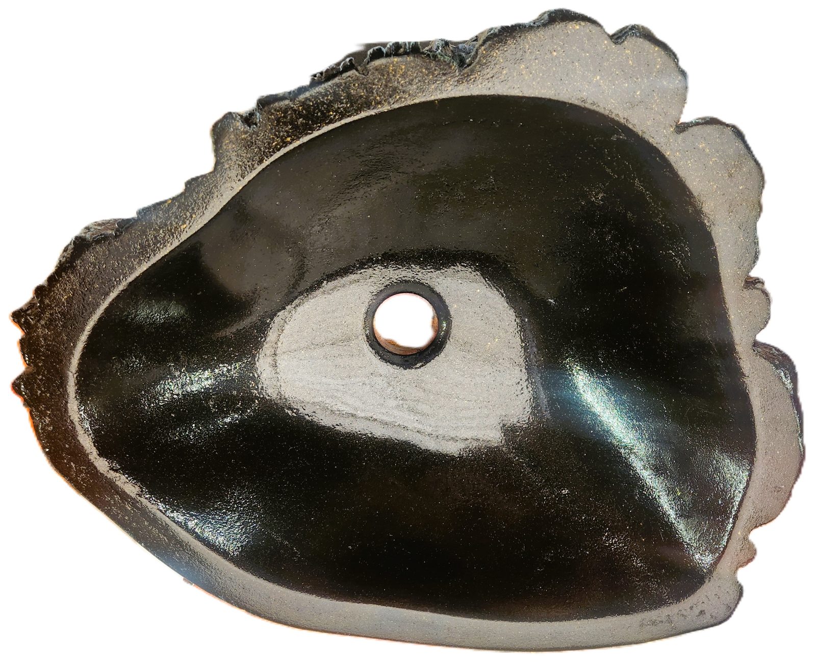 Top-down view of a black concrete vessel sink with a polished bowl and cast drain hole.
